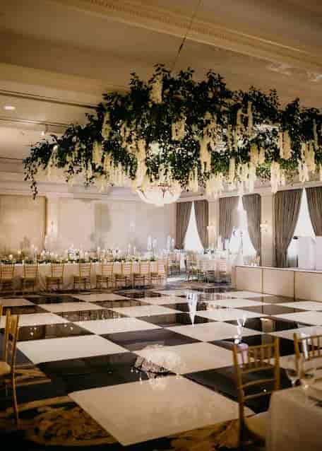 Elegant ballroom with floral canopy at The Houstonian Hotel for weddings and events.