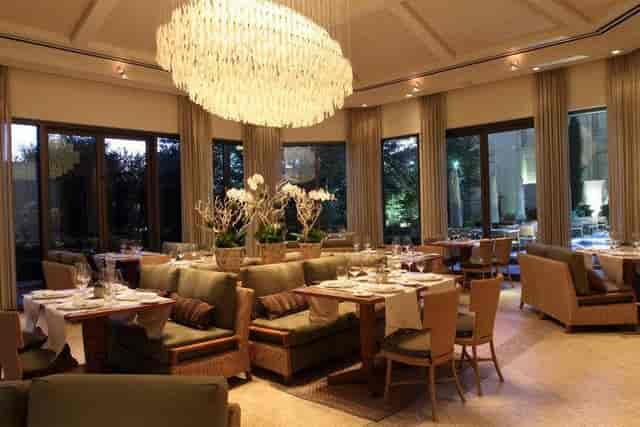 Elegant dining room with warm lighting, perfect for corporate events or private meetings.