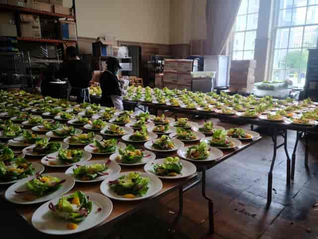 Cotton Belt Room setup with neatly arranged salad plates for a professional event.