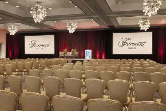 Elegant conference space at Fairmont Dallas with chandeliers, perfect for corporate events.