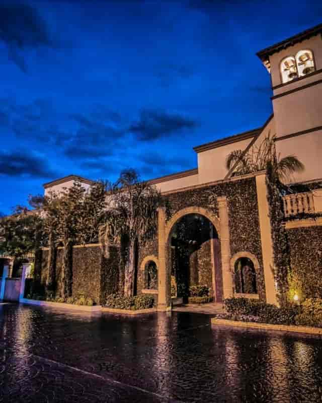 Magnolia Ballroom at dusk, lush greenery, ideal for upscale events and gatherings.