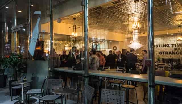 Vibrant networking event at The Cellar, stylish urban venue with elegant lighting.