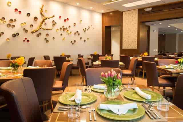 Main Dining Room at Kiran's with elegant tables, perfect for corporate events or celebrations.