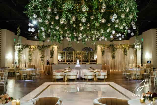 Champagne Suite at The Revaire: elegant wedding venue with lush greenery and ambient lighting.