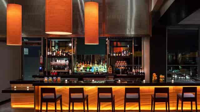 Modern bar in Terrace 54, inviting atmosphere for networking events and relaxation.