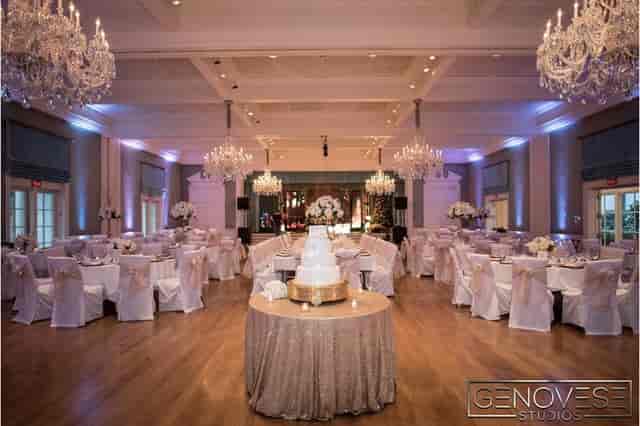 Elegant Houston Racquet Club event space with white linens, ideal for wedding receptions.