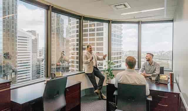 Modern meeting space with large windows, ideal for client meetings and brainstorming sessions.