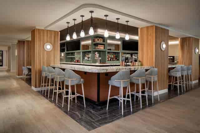 Modern bar area in Sheraton Fort Worth, ideal for networking events and gatherings.
