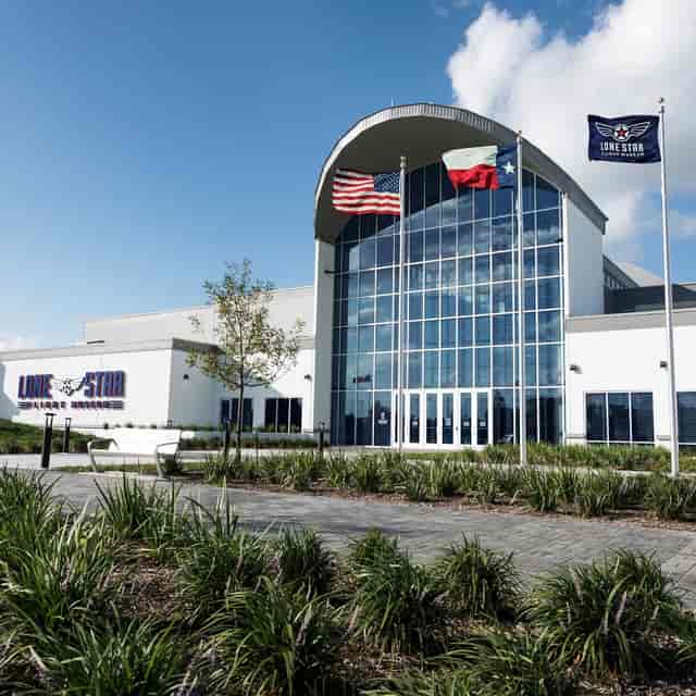 Heritage Hangar at Lone Star Flight Museum, modern event venue with large glass windows.