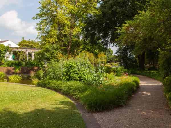 Circular Lawn at Texas Discovery Gardens: serene path for outdoor events and team-building.