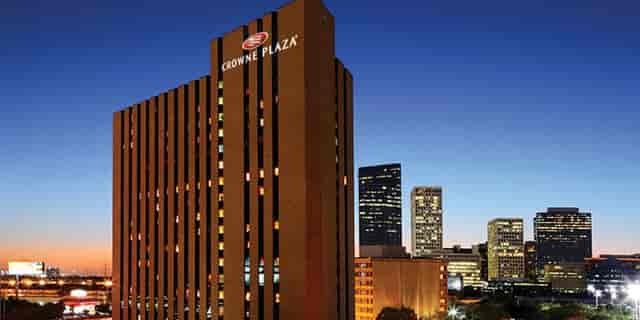 Crowne Plaza Houston conference center with city skyline, ideal for meetings and events.