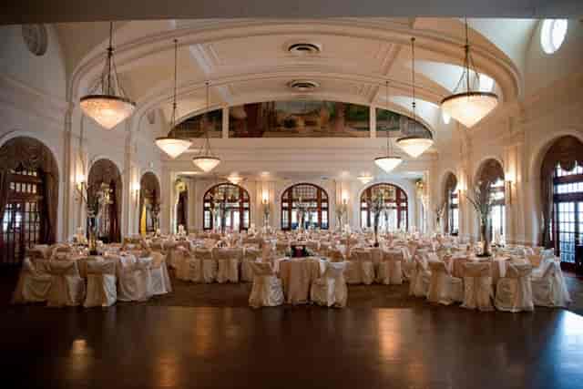 Elegant Crystal Ballroom banquet hall with round tables, ideal for weddings and corporate events.