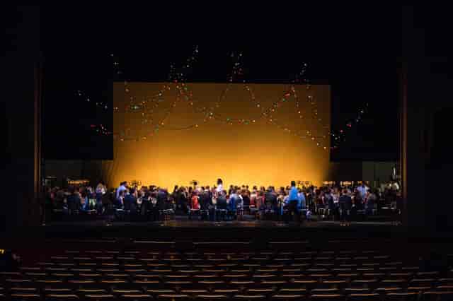 Onstage Dinner at Houston Ballet with colorful lighting and vibrant theater setup.