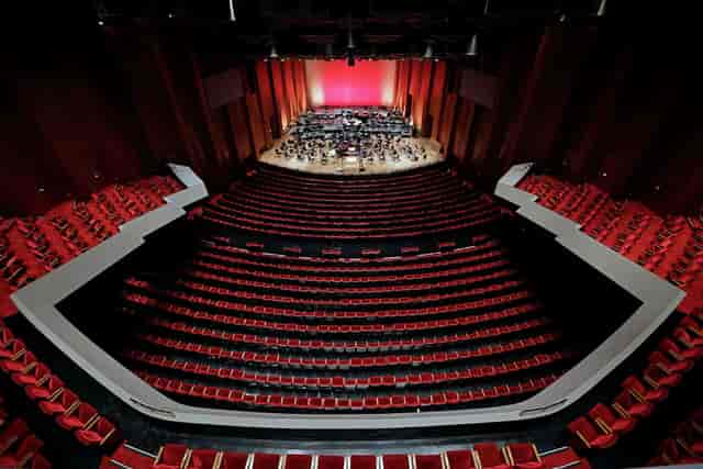 Jones Hall auditorium with tiered red seating, ideal for orchestral performances and events.