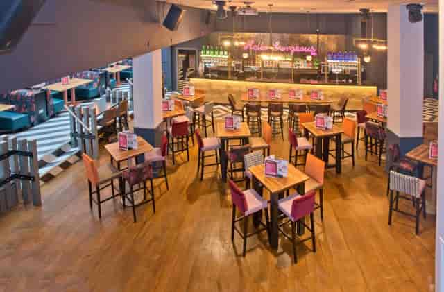 Abbey Vaults bar with neon lighting for corporate networking and team-building events.
