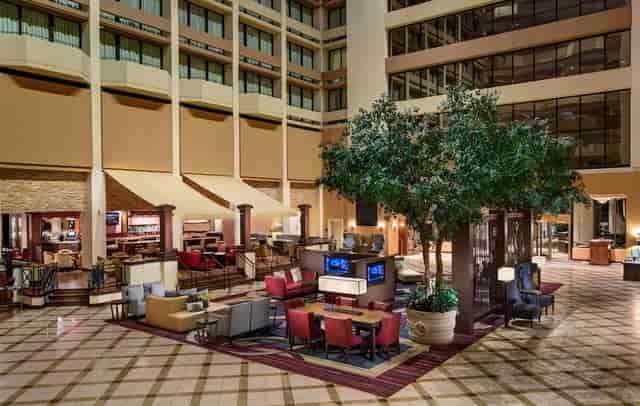 Spacious hotel lobby at Houston Marriott Westchase, ideal for meetings and networking.