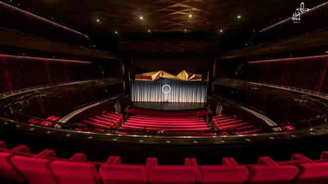 Elegant theater in Ithra with red upholstery, ideal for corporate events and performances.