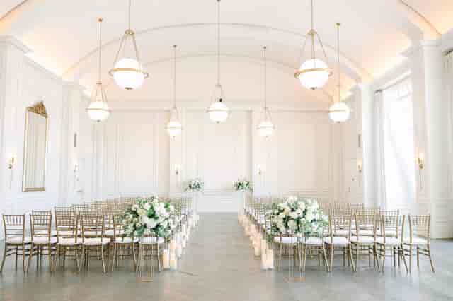 Elegant Governor's Ballroom with gold chiavari chairs for weddings and formal events.