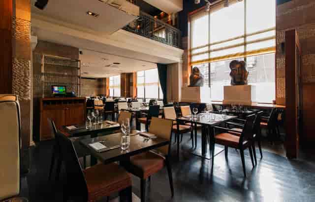 Modern restaurant venue with elegant decor for intimate meetings and small events.