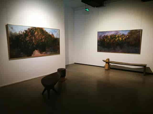 Contemporary art gallery with large paintings, ideal for intimate exhibitions or networking.