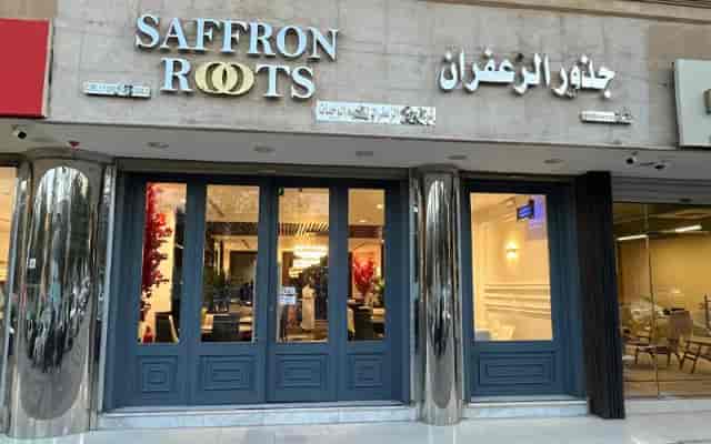 Saffron Roots restaurant entrance with modern façade, ideal for corporate events and gatherings.