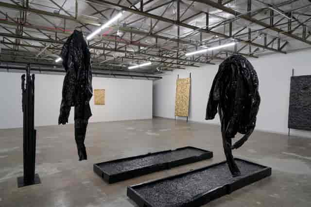 Abstract dark sculptures in Dallas Contemporary for artistic events and gatherings.