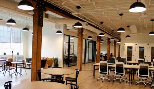 Versatile event space with natural light, ideal for workshops and seminars.