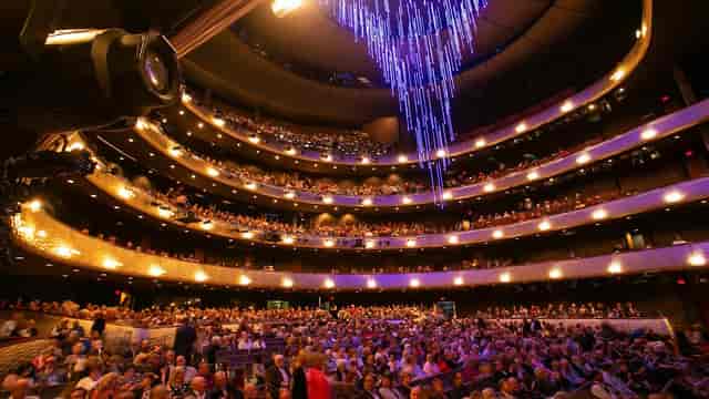"Winspear Opera House auditorium with stunning chandelier for events and performances"