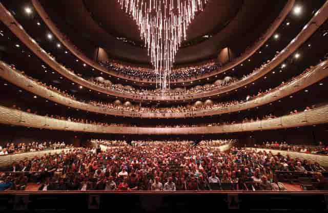 Winspear Opera House auditorium with elegant chandelier, perfect for large events.