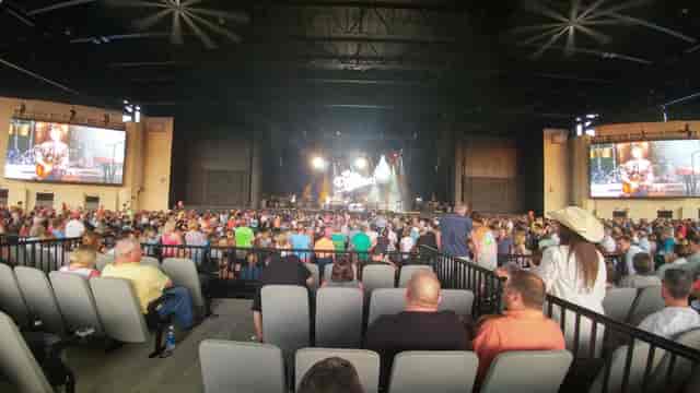 Vibrant concert at VIP Club in Dos Equis Pavilion, showcasing audience engagement and stage design.