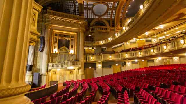 Ornate Majestic Theatre interior with plush seating for conferences and gala events.