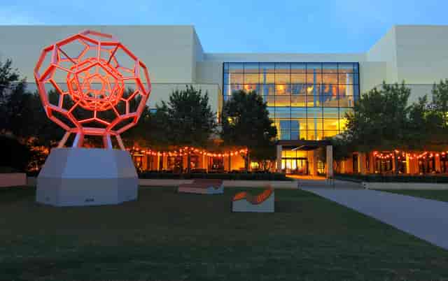 Outdoor shopping mall venue at NorthPark Center with vibrant sculpture for events.