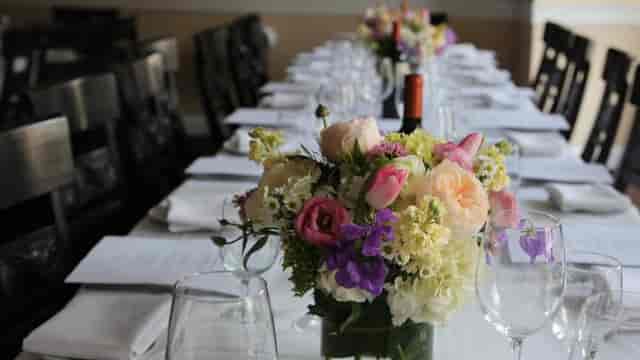 Elegant dining table at La Pergola for corporate events and private gatherings.
