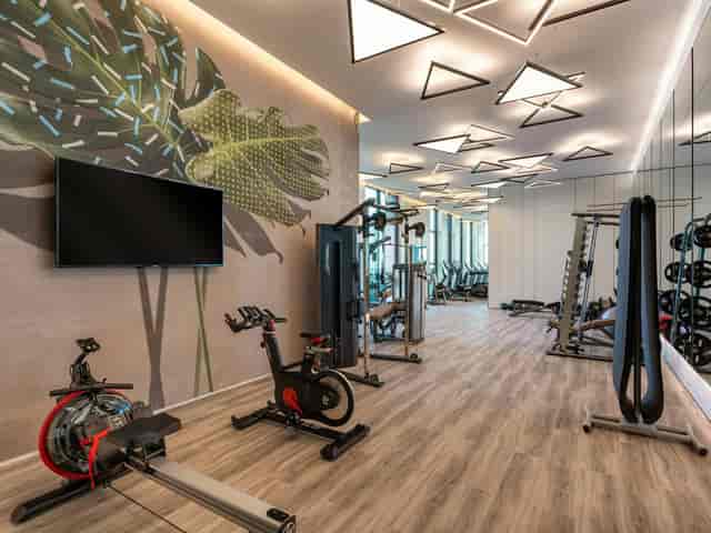 Modern fitness area in Fairmont Ramla for wellness events and retreats.