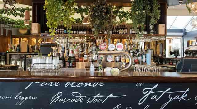 Alcove deck bar at The Cove Hotel, perfect for networking events and casual meetups.