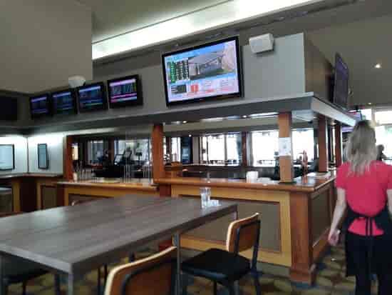 Sports bar at The Cove Hotel, featuring screens for events and casual gatherings.