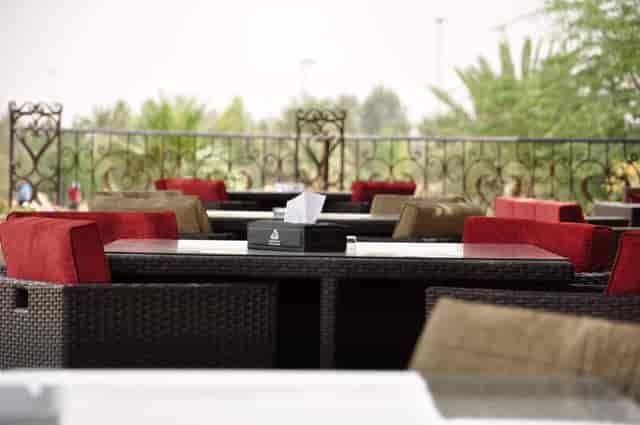 Outdoor terrace at Riyadh Golf Club with stylish seating for meetings and networking events.