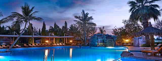 Villas at Al Nahda Resort & Spa with a stylish pool, ideal for weddings and corporate retreats.