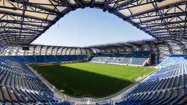 Modern Al Nasr Club football stadium with tiered seating, perfect for events and sports.