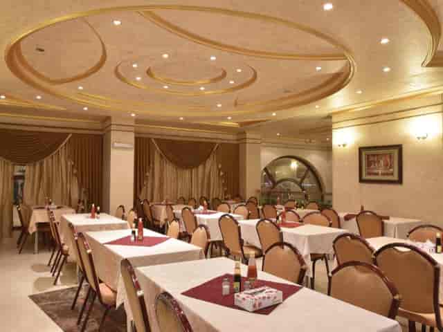 Sophisticated dining area at Al Mukhtara Hotel, ideal for corporate events and gatherings.