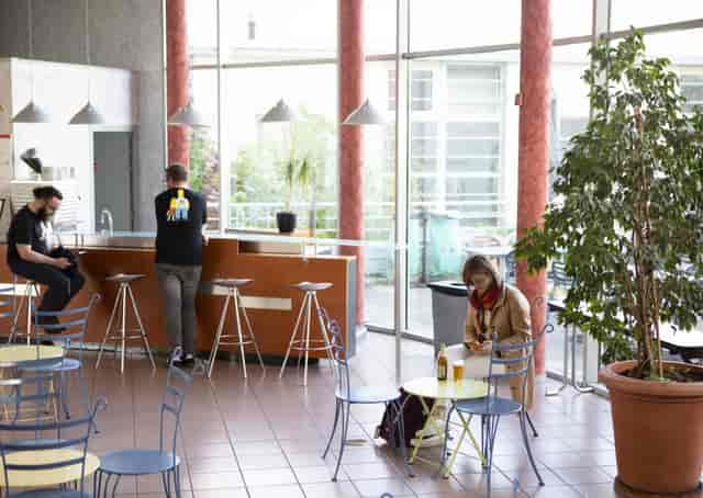 Modern cafe in CISL Lyon, bright space for networking and meetings.