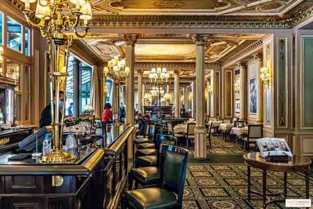 Elegant café venue with ornate decor for corporate events and celebrations.