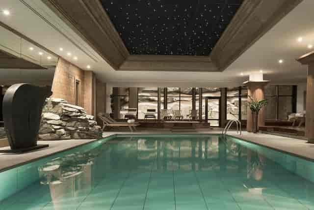 Indoor pool with starry ceiling at La Rôtisserie, perfect for wellness retreats and spa events. 
