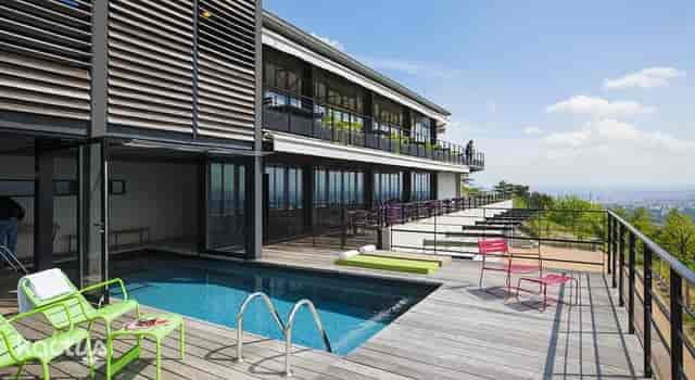Modern l'Atelier venue at Ermitage Hotel with terrace, ideal for events and networking.