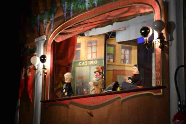 Puppet show stage with vibrant backdrop for family-friendly events in Lyon.