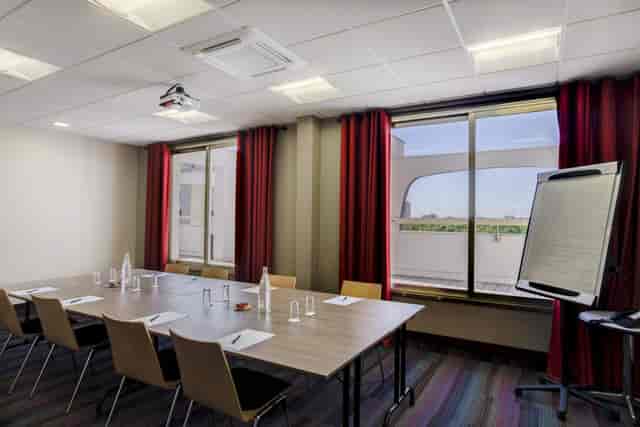 Main Conference Hall at Hôtel des Congrès: modern venue for professional meetings and presentations.