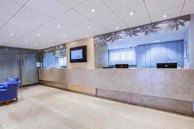 Modern hotel reception area with sleek design for meetings and events.