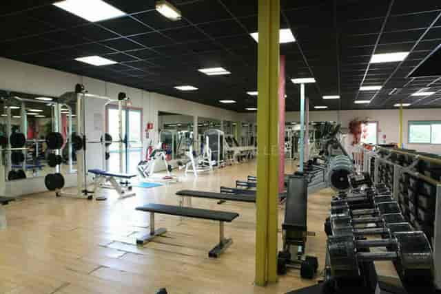 Spacious fitness center at Hôtel Léonard de Vinci for wellness events and corporate retreats.