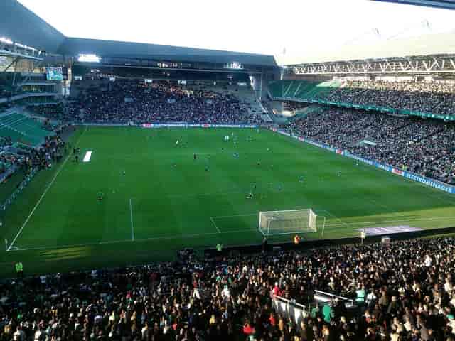 Tribune Henri-Point stadium with vibrant fans, perfect for sports events and festivals.