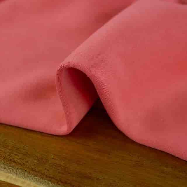 Coral linen fabric for vibrant event decor and table linens at Atelier de la Création.